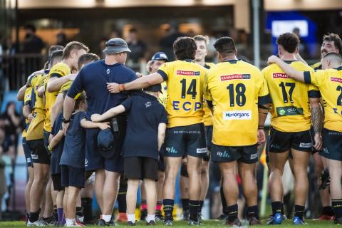 Ando and Sharks in huddle 