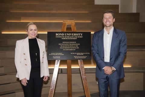 ADCO representatives with the plaque opening the new building