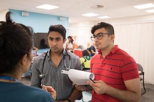 Two students performing a medical simulation