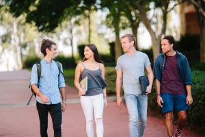 A group of students walking through the campus